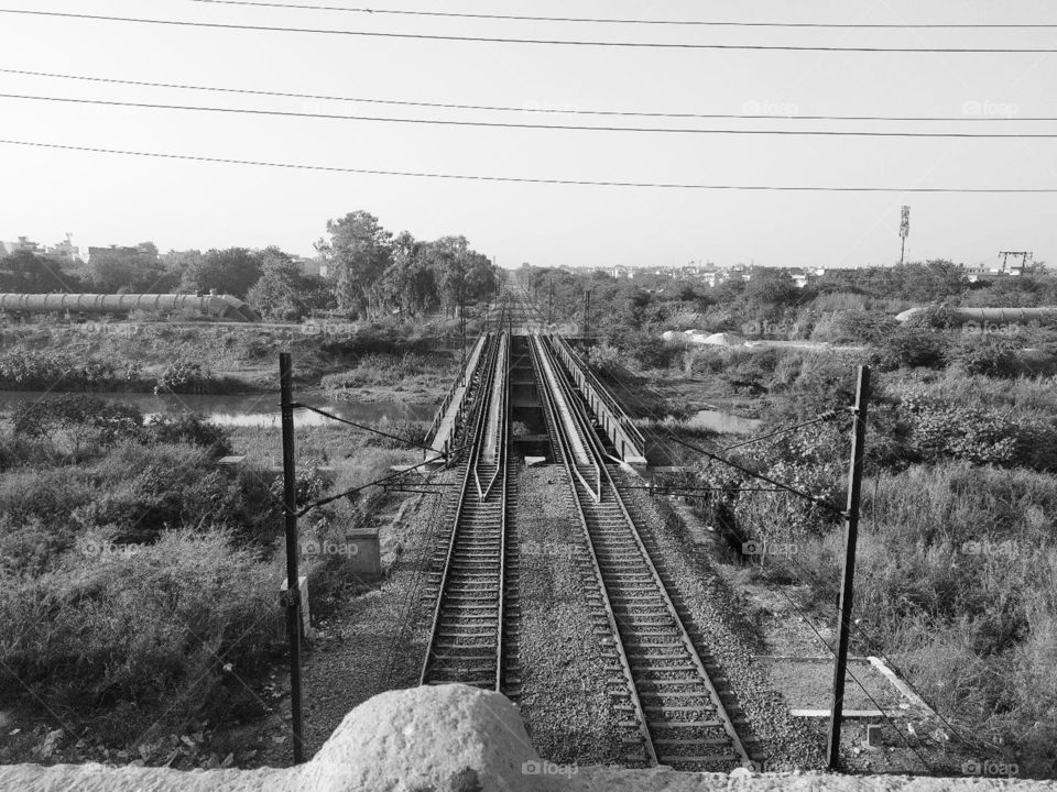 there is a track of rail. someone is going own hometown by barefoot through this track.. we have saw a lot people as labours.. they are going to hometown by as railways track. I did show this only of Photographers.