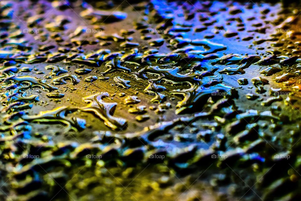 Pools of water on table surface