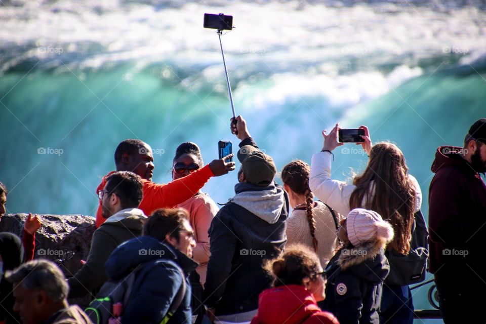 Crowd of people are taking photos on Niagara falls