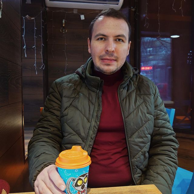 portrait of a man in a cafe