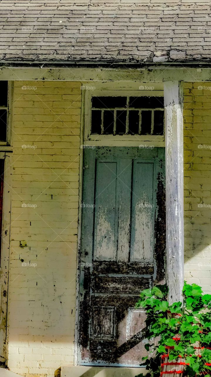 Dilapidated Door on a TC Commons building