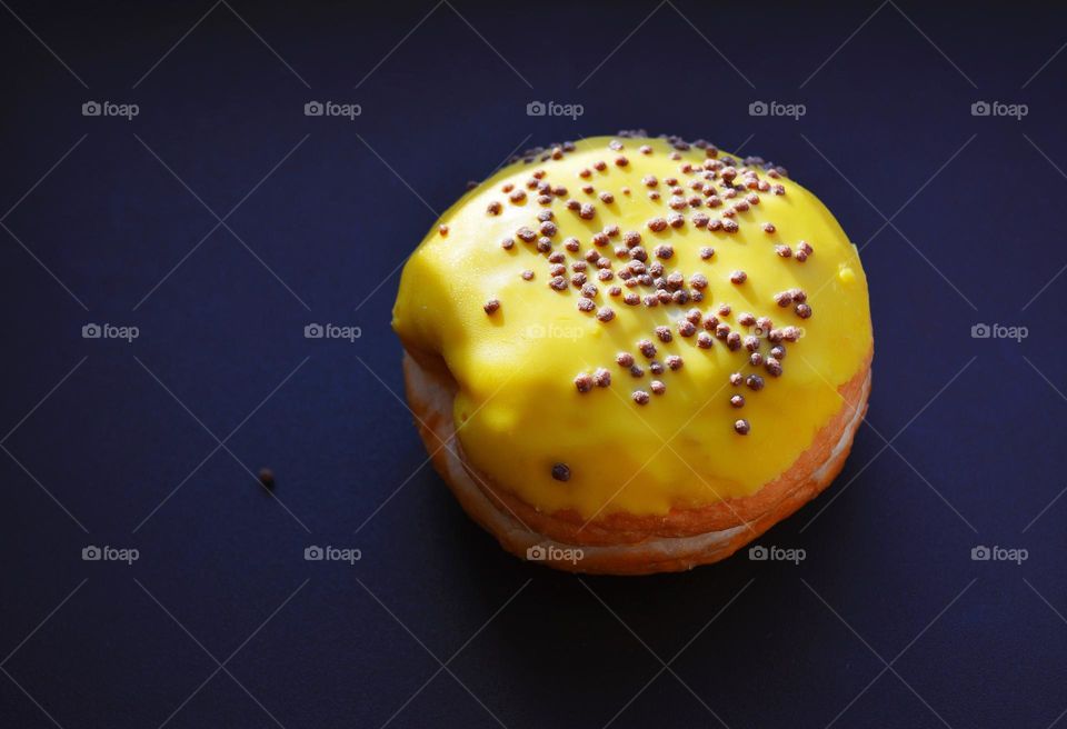 sweet bun donut 🍩 in sunlight brown table background