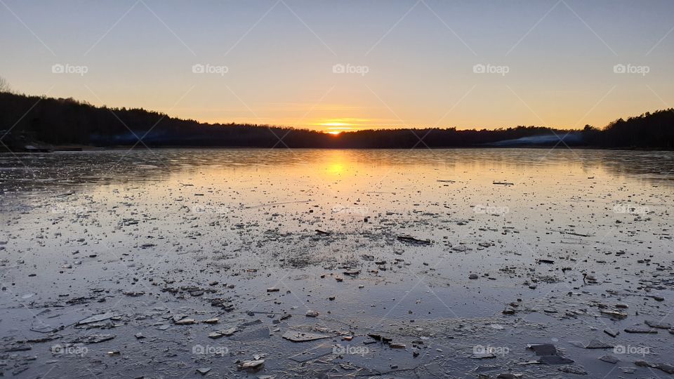 Sunset reflection on frozen lake ice winter . Solnedgång reflektion på frusen sjö is Härlanda tjärn 