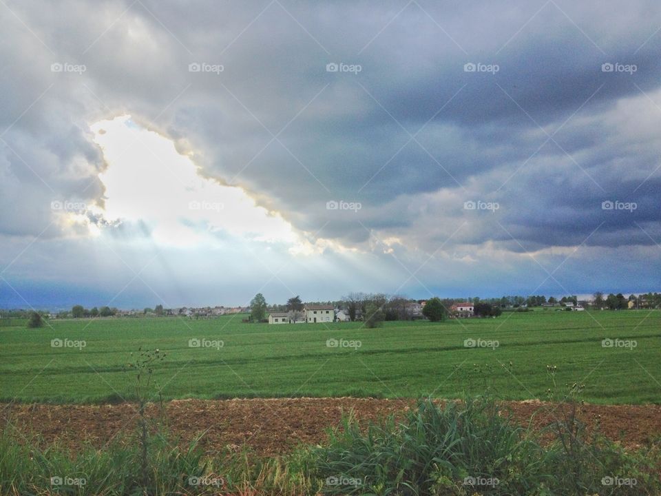 A hole in the clouds. A hole in the clouds in a open field near my home,Italy