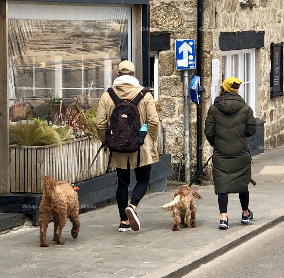 Two People And Their Dogs