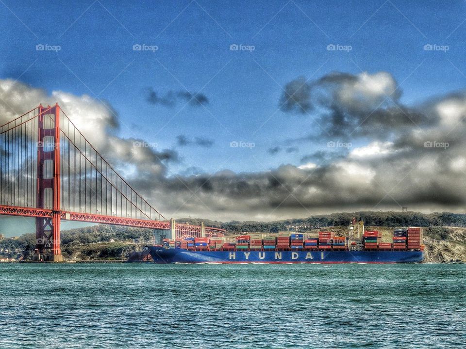 Cargo Ship Passing Under Golden Gate Bridge