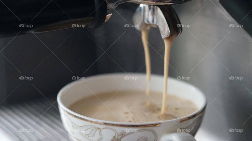 Coffee pouring from Espresso Machine