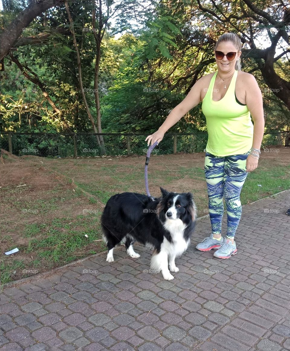 A lady walking with her beautiful dog