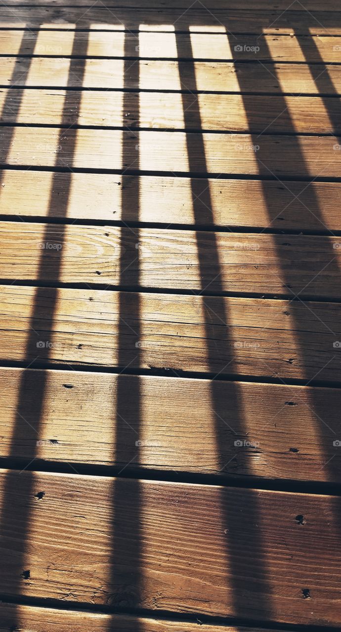 shadow on the deck sunset