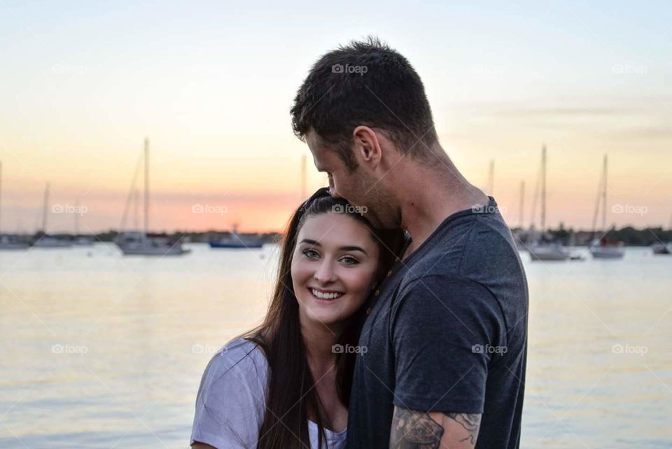 sunset couple. kissing couple at Stuart, Florida sunset