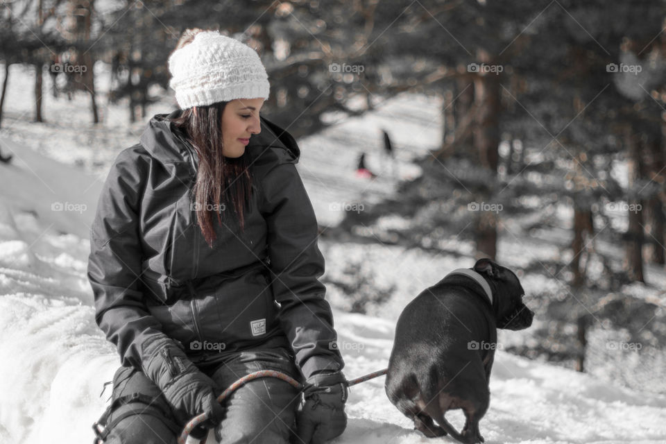 Woman and dog in the snow