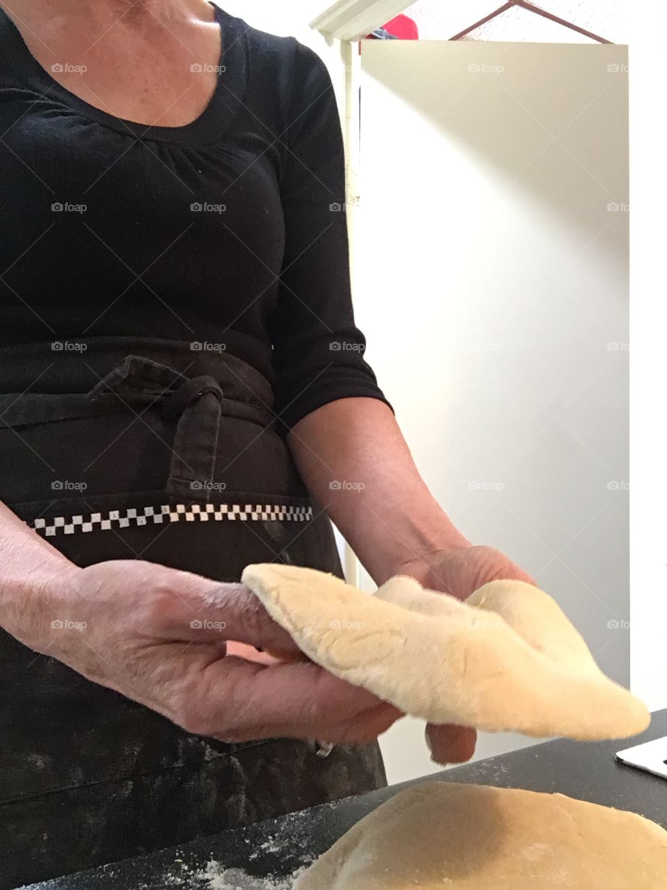 Handy woman making homemade bread for pita working with dough