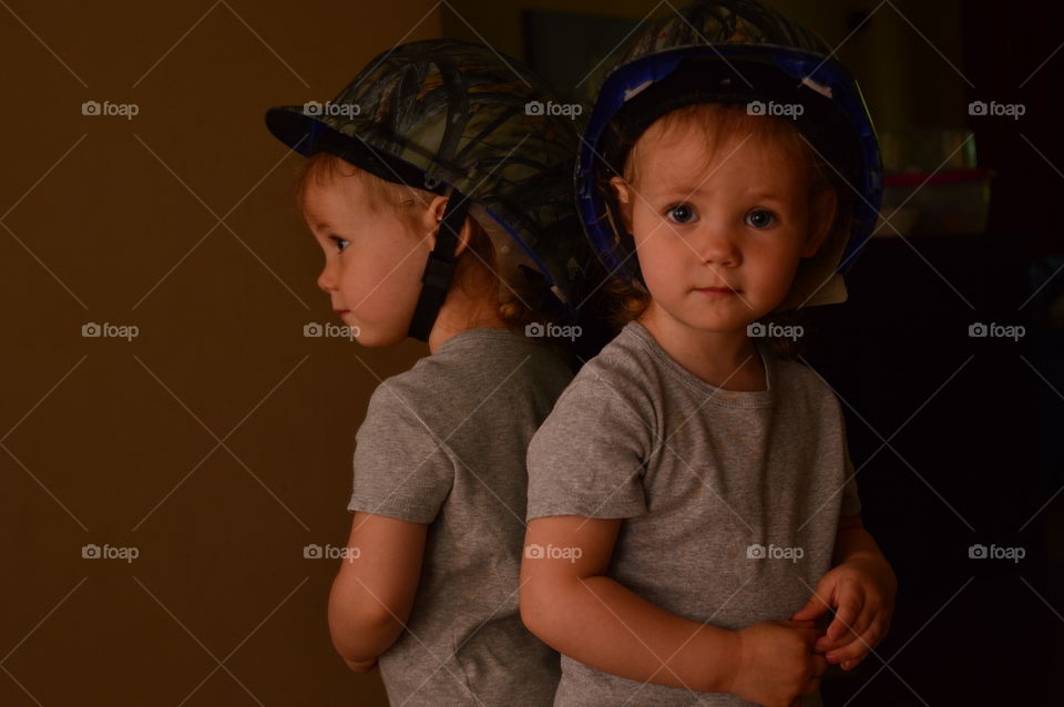 Reflection of a boy wearing hat