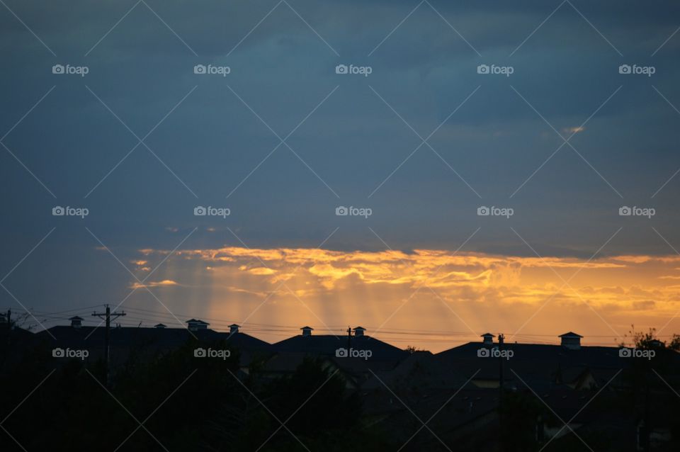 Sun rays over buildings 
