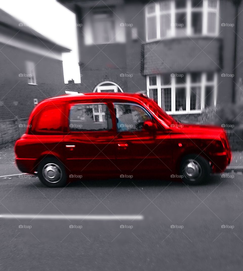 Red taxi. Brightened up this normal photo with a red colour splash!