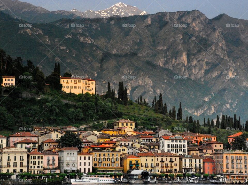 Bellagio, Italy. A beautiful view of Bellaggio from Lake Como with the Italian Alps as a backdrop