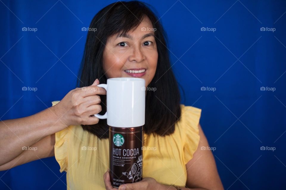 Woman drinking Starbucks hot cocoa 