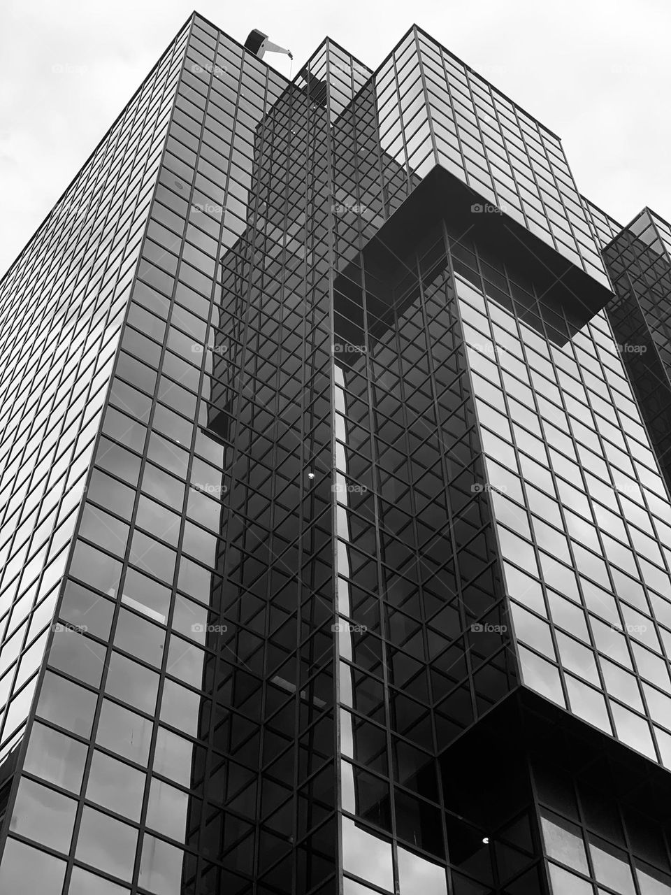 geometric and modern crystal skyscraper stands out against the sky in London