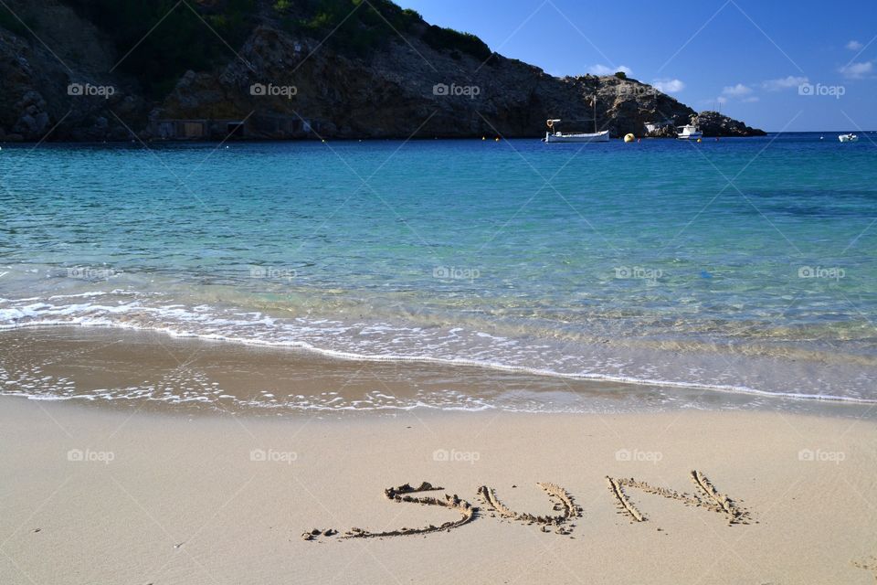 The word Sun in the sand. The word Sun written in the sand in Cala Vadella, Ibiza - Spain