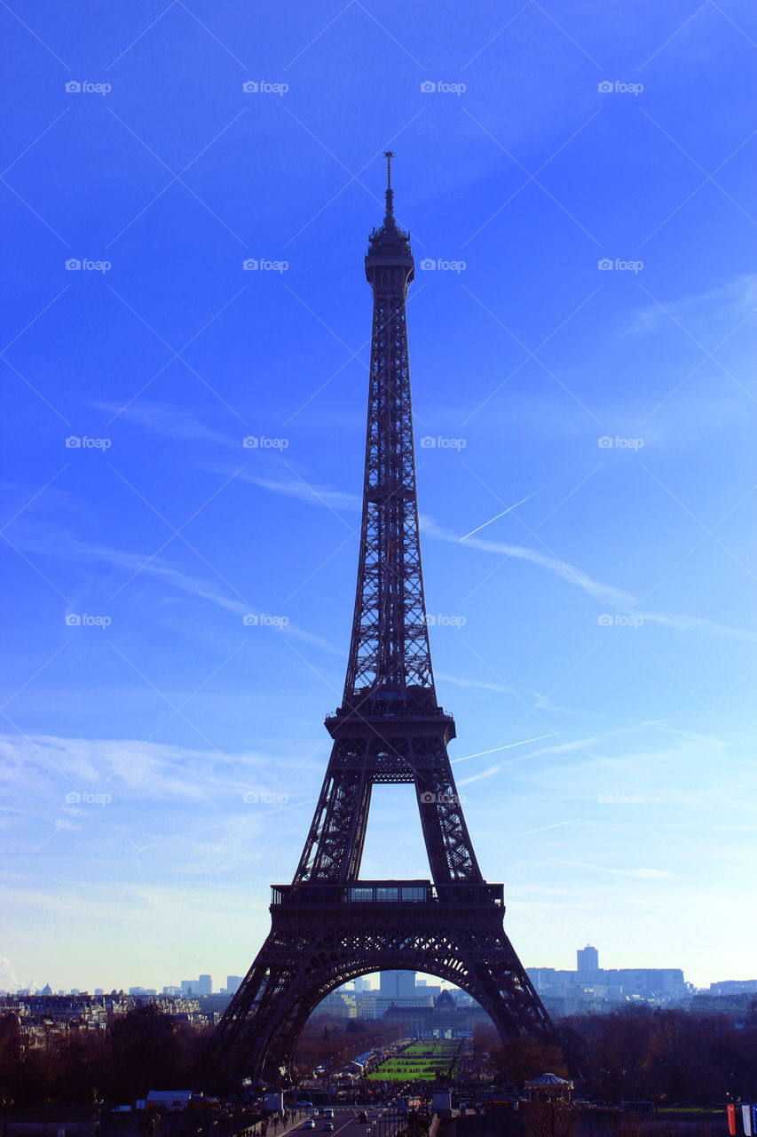 The eiffel tower in a blue sky 