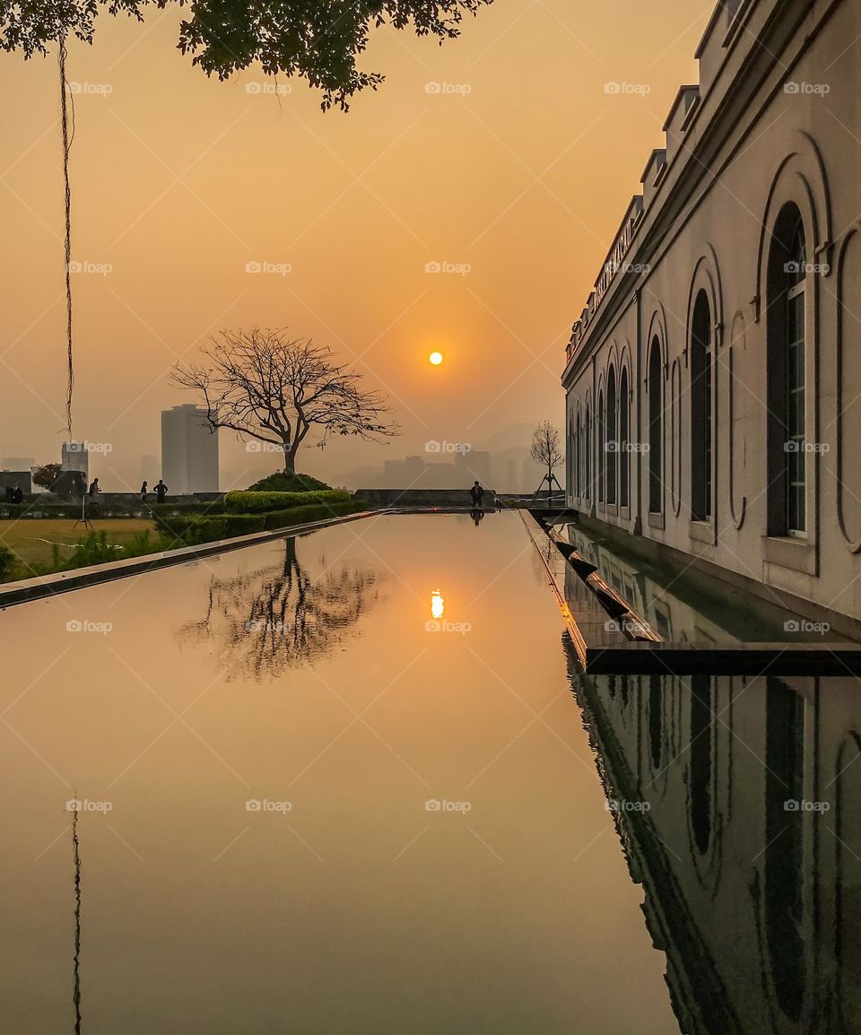 Sunset view and reflection of urbanization 