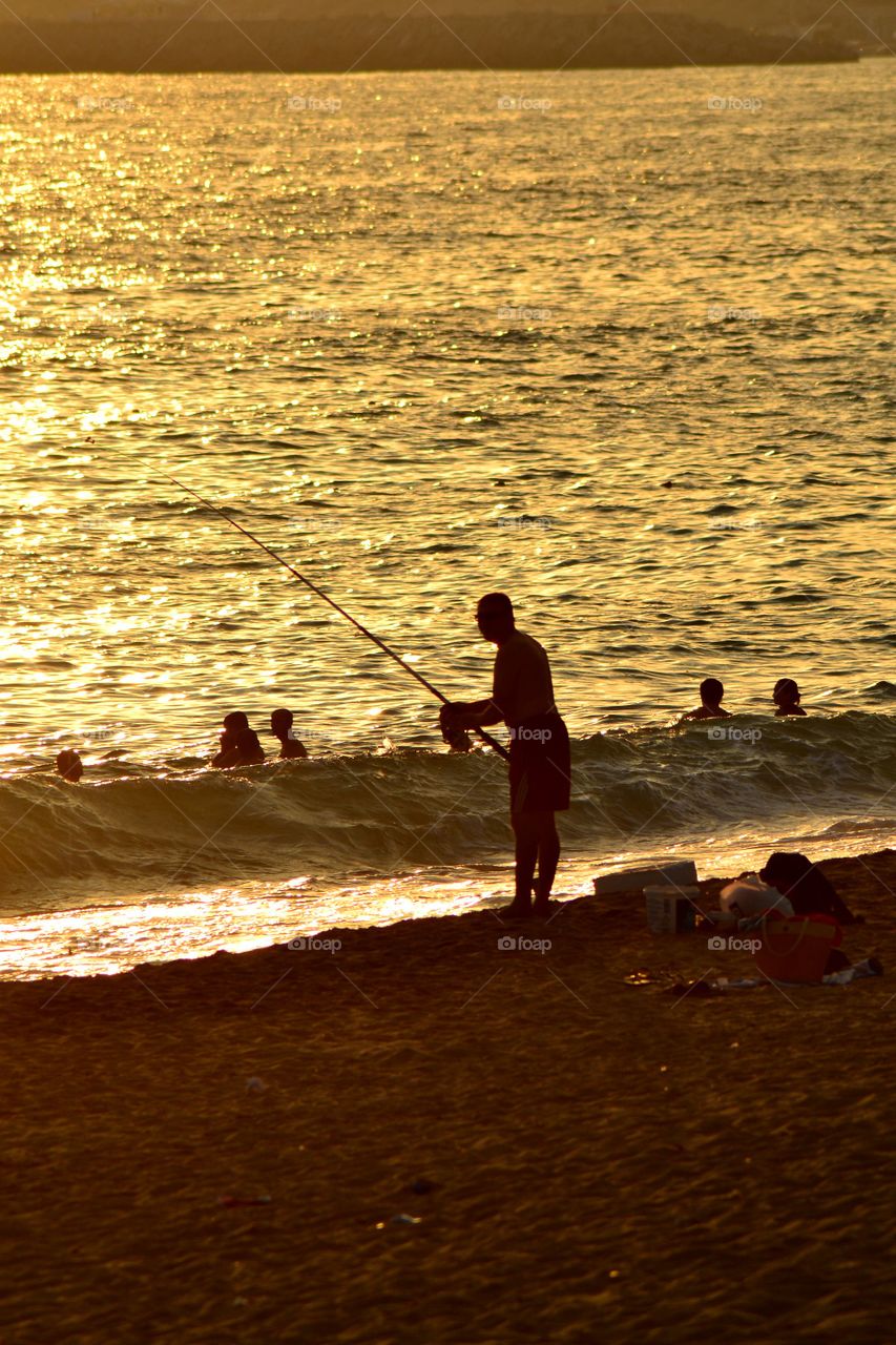 fishing on the beach in Alanya turkey in sunset