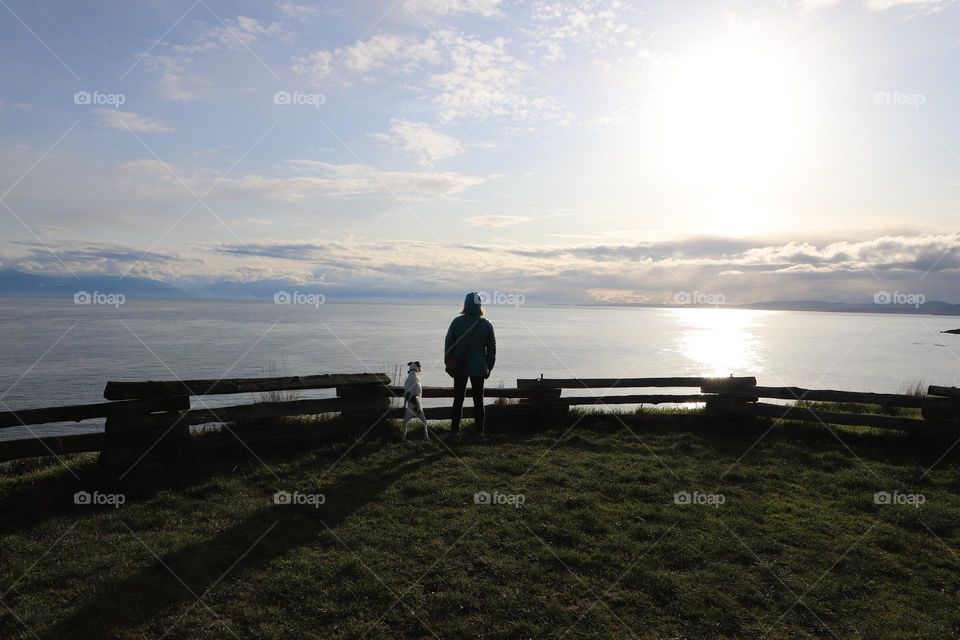 Woman and dog  enjoying the view