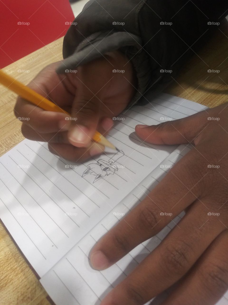 Chold drawing a cartoon character