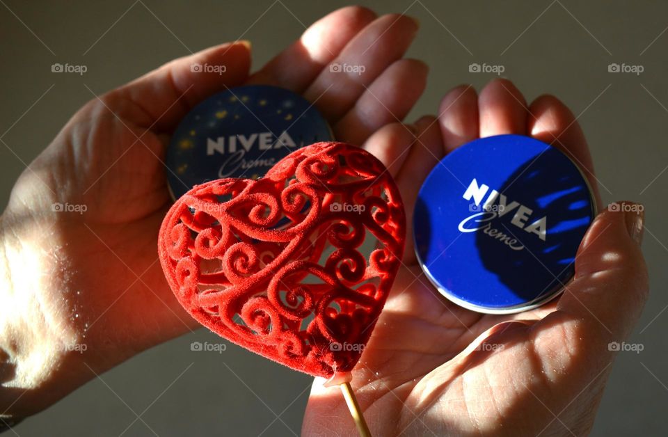 love Nivea, cream in the female hands