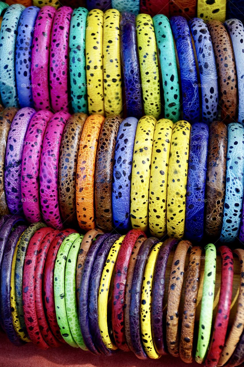 Rows of Colourful leather textured bangles