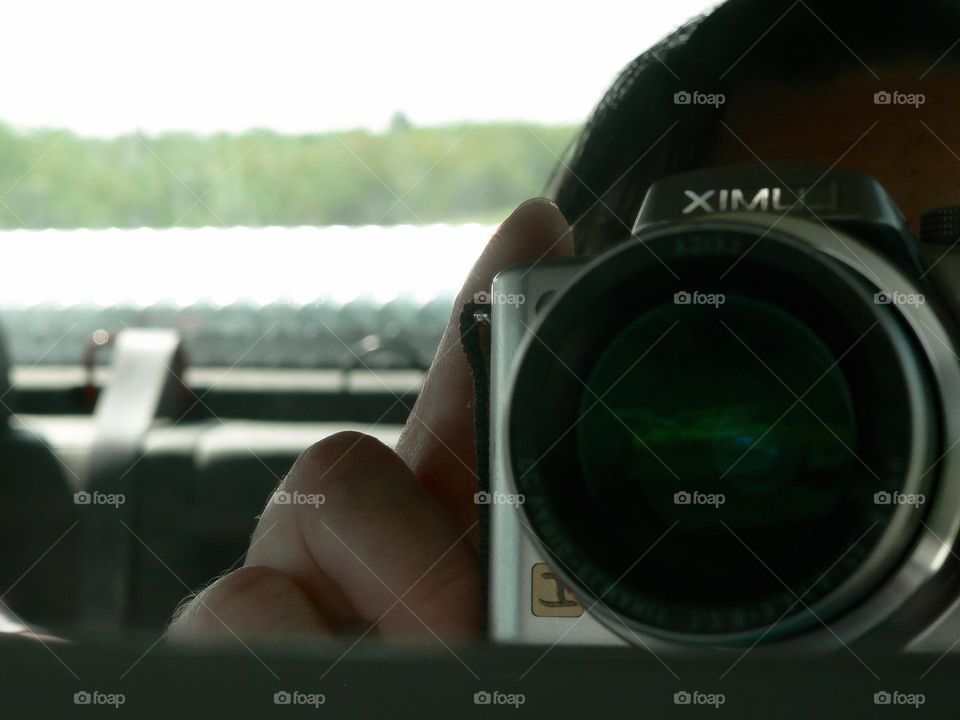 Camera shot during road trip from the passenger inside mirror during the summer time.