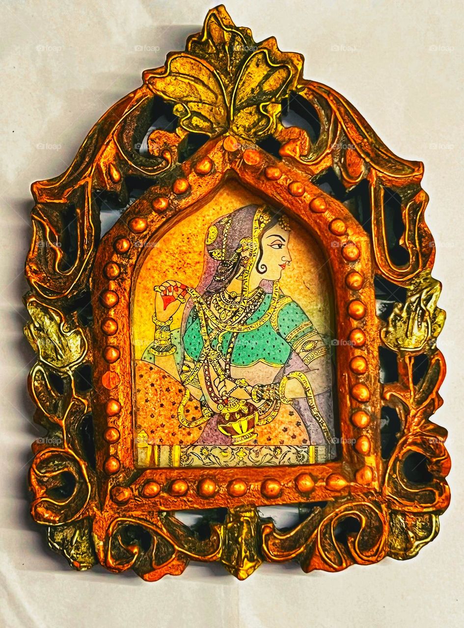 An intricately carved stone art encased in wooden frame from Rajasthan, India 