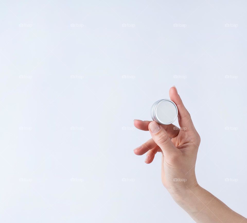 woman hands holding beauty products