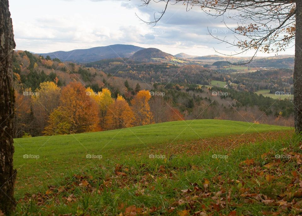 Looking to the hills splattered with autumn colors. New England scenery at it's finest.