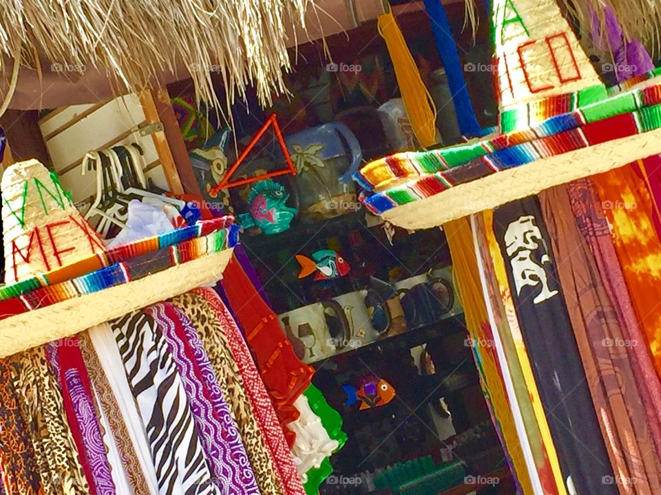 Colorful Straw Market on the Street in Costa Maya, Mexico.   Ponchos, Sombreros and blankets. 