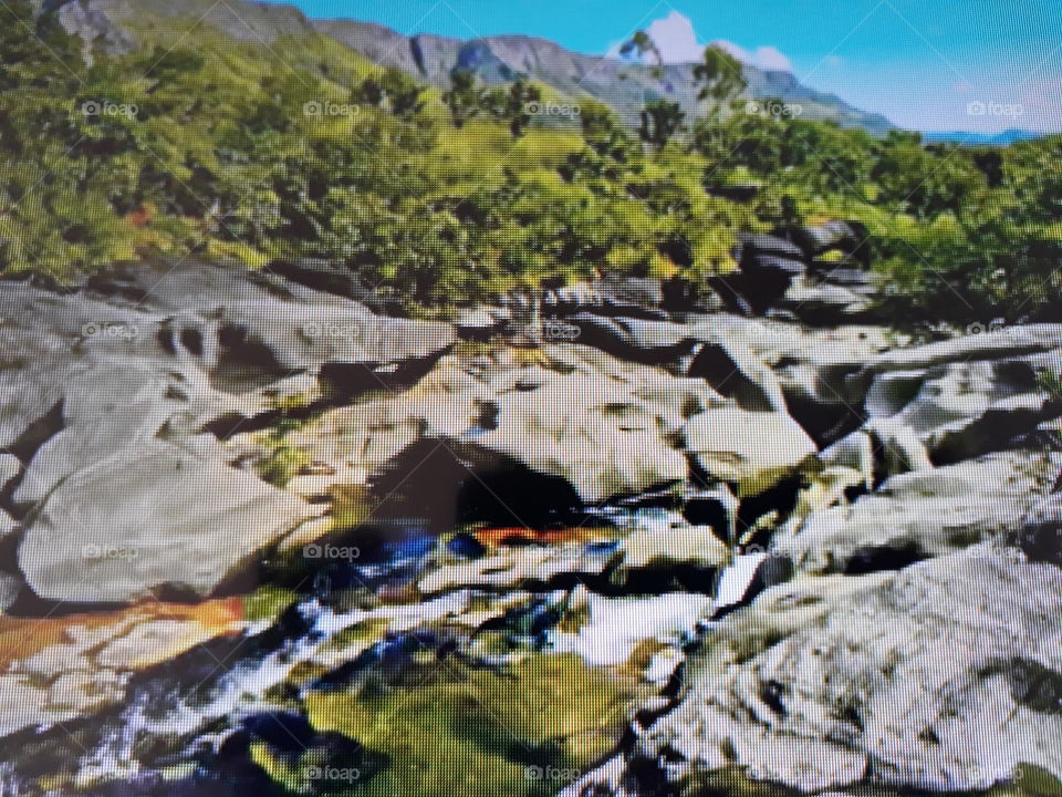 Beautiful photo worthy of a postcard with crystal clear water running down the rocks, transmitting an inner peace to the human being.
