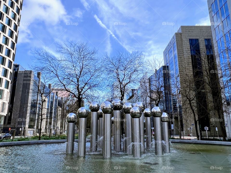 Urban nature - Water: city centre abstract fountain with metal pillars with round heads