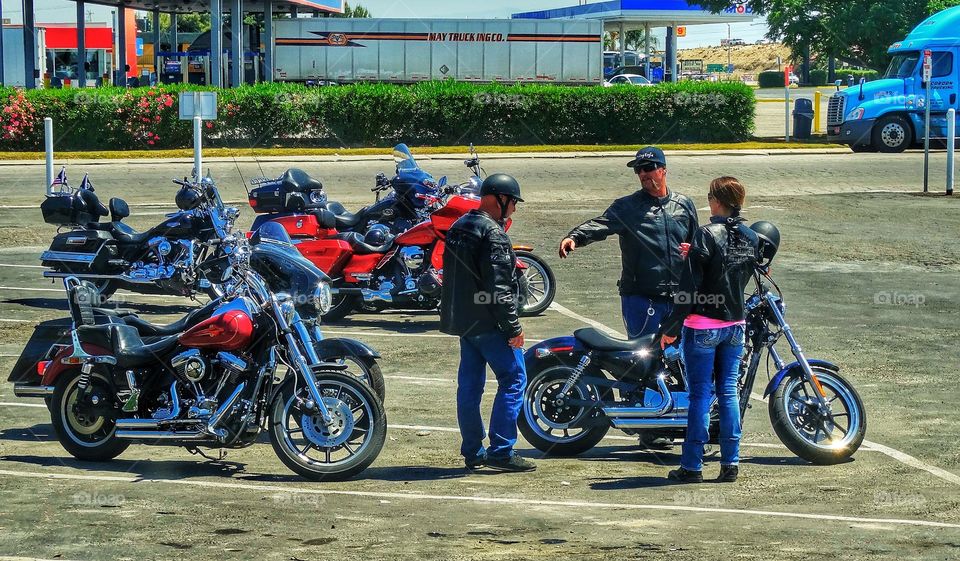 Motorcycle Riders In A City Parking Lot