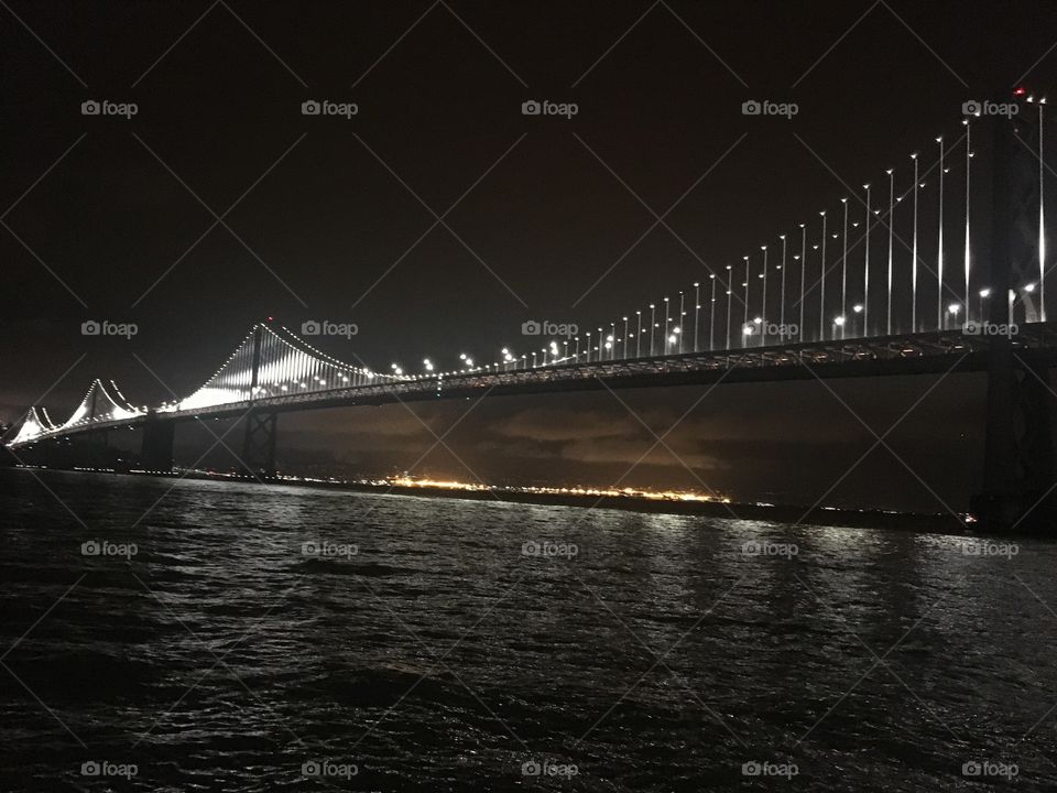 The Bay Bridge in San Francisco lit up at night. 
