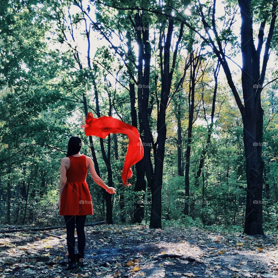 The girl with the red scarf in spring Park