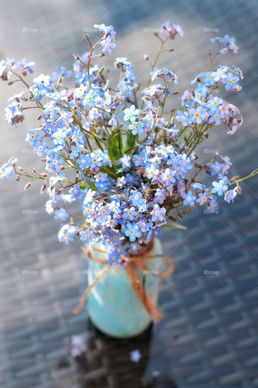 Forget-me-nots in a turquoise vase 