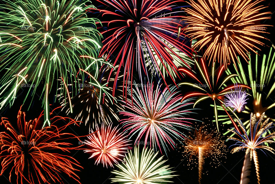 Multicolored fireworks display at night