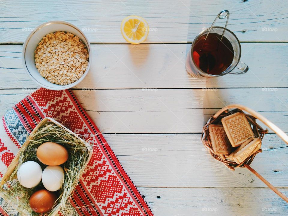 eggs, oatmeal, biscuits and a cup of tea