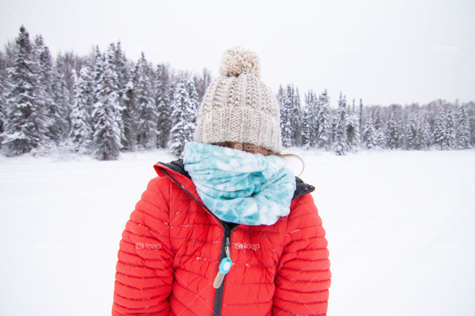 Nicole shivers after getting a face full of snow in chilly Alaska in winter 