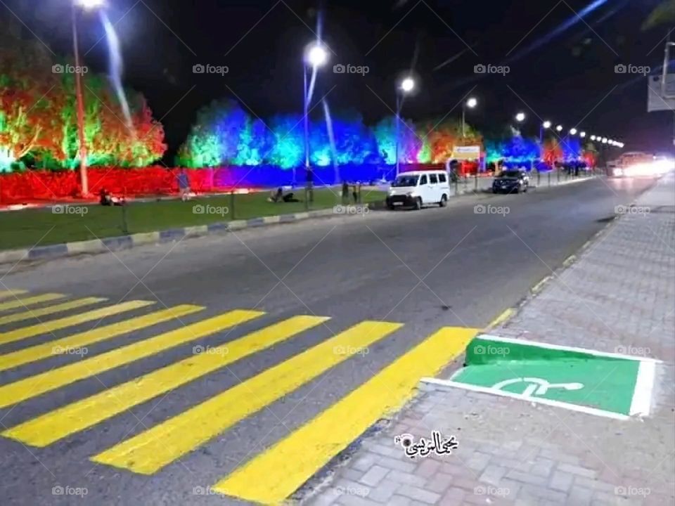 A very beautiful picture, and there is no better picture than it. There is no better picture of green herbs and colorful, red and white roses than it. Glory be to God, the natural and picturesque view, and there is no more