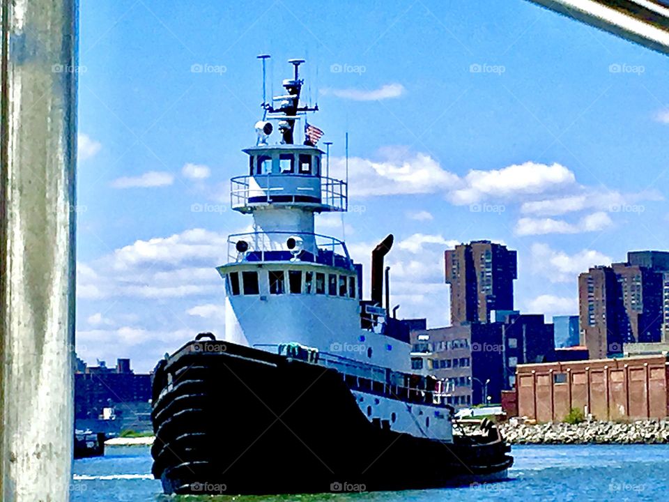 Another view of the gigantic ocean liner that passed us by at Newtown Creek in LIC, Queens, NY on a bright sunshiny day in the summer of 2021. It has three main levels and a stacked fly bridge on top. Hypnotic Productions