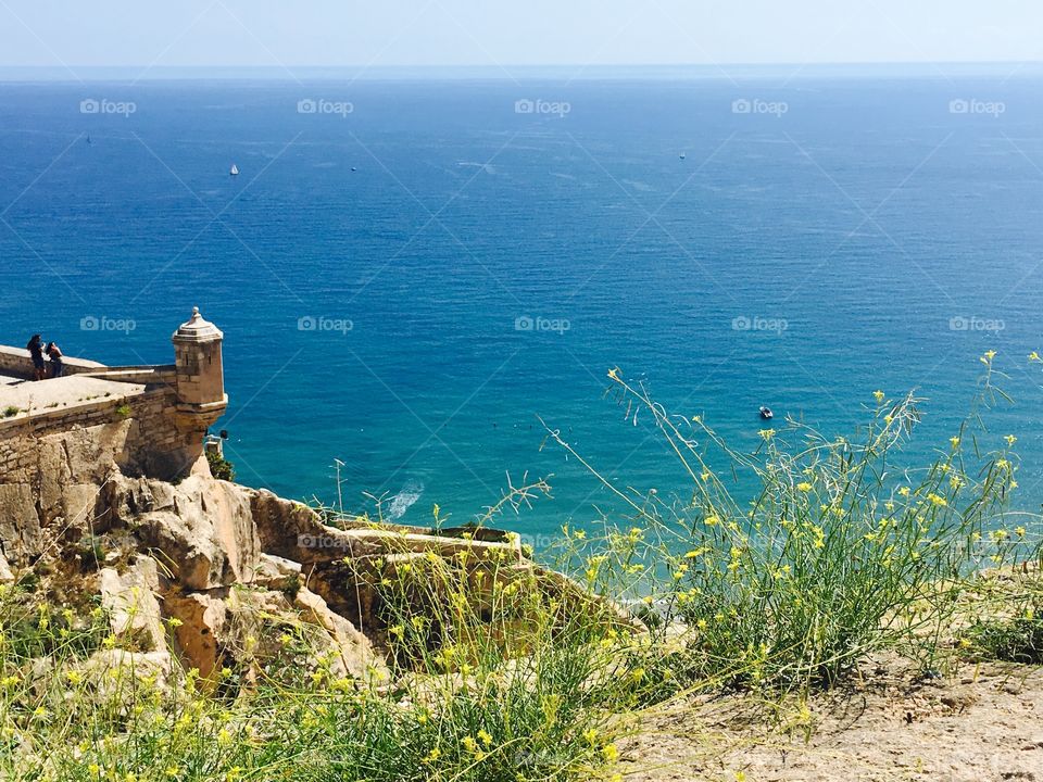 A view of the beautiful turquoise ocean from the Santa Barbara Castle in Alicante, Spain 