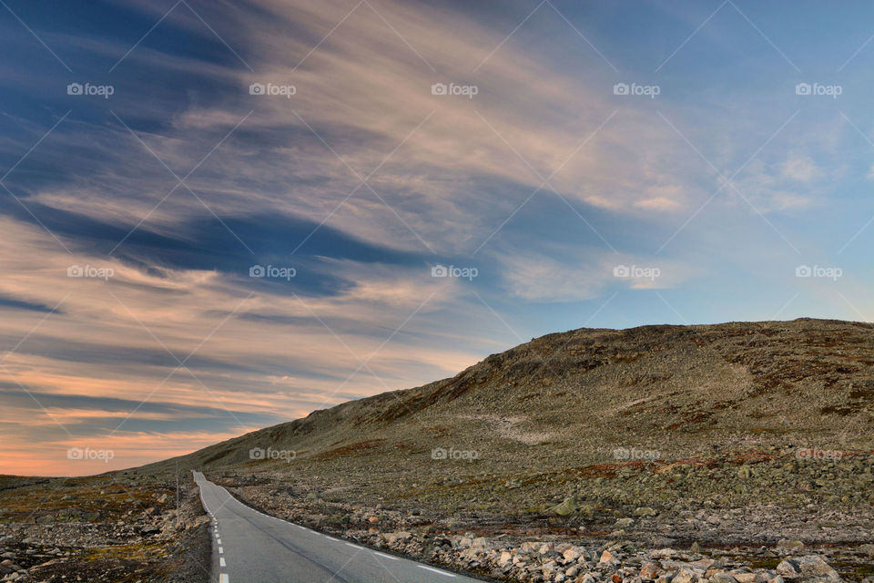 The Snow Road, Norway. Golden hour over the mountains of Aurland,  Norway in summer