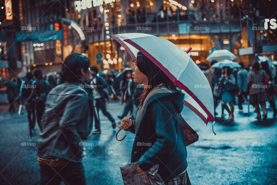 Hold onto the moment. Snap - busy streets, the drizzle of Tokyo's peeps always in style. Even their umbrellas are on point