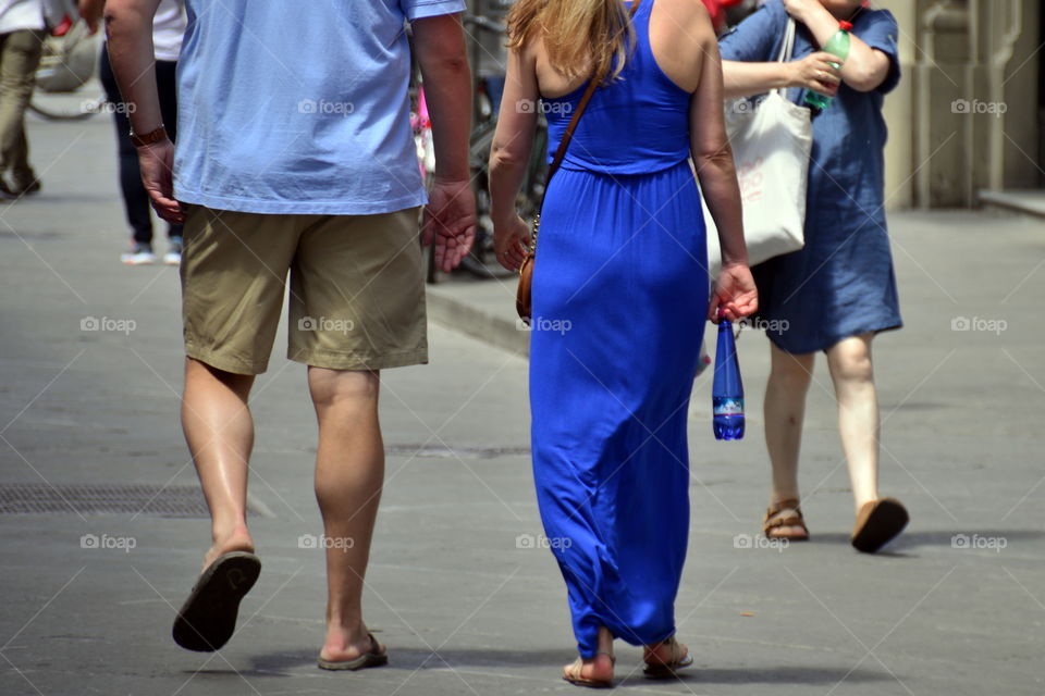 ouple of tourists walking through the streets of the city